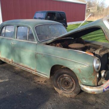 Two antique Mercedes Benz 4 door vehicles rescued from a barn.
